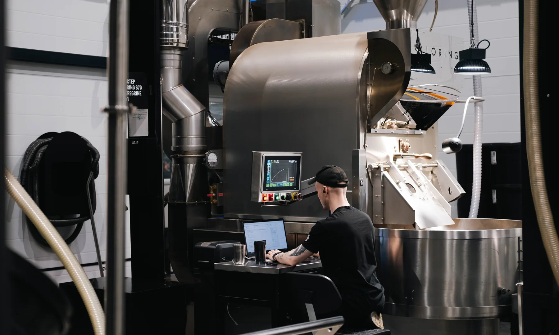 Production coffee roaster monitored during a coffee roasting weight loss and yield run